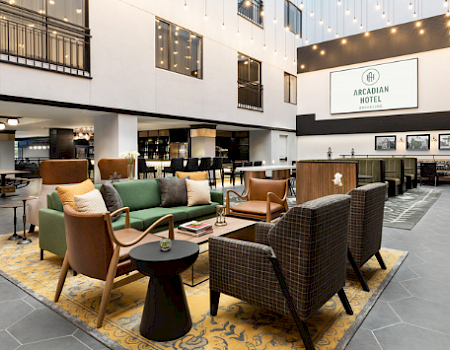 A collage showing a grand hall full of diners, a cozy hotel lobby lounge, and the exterior of a building with a “Coloidge” sign.